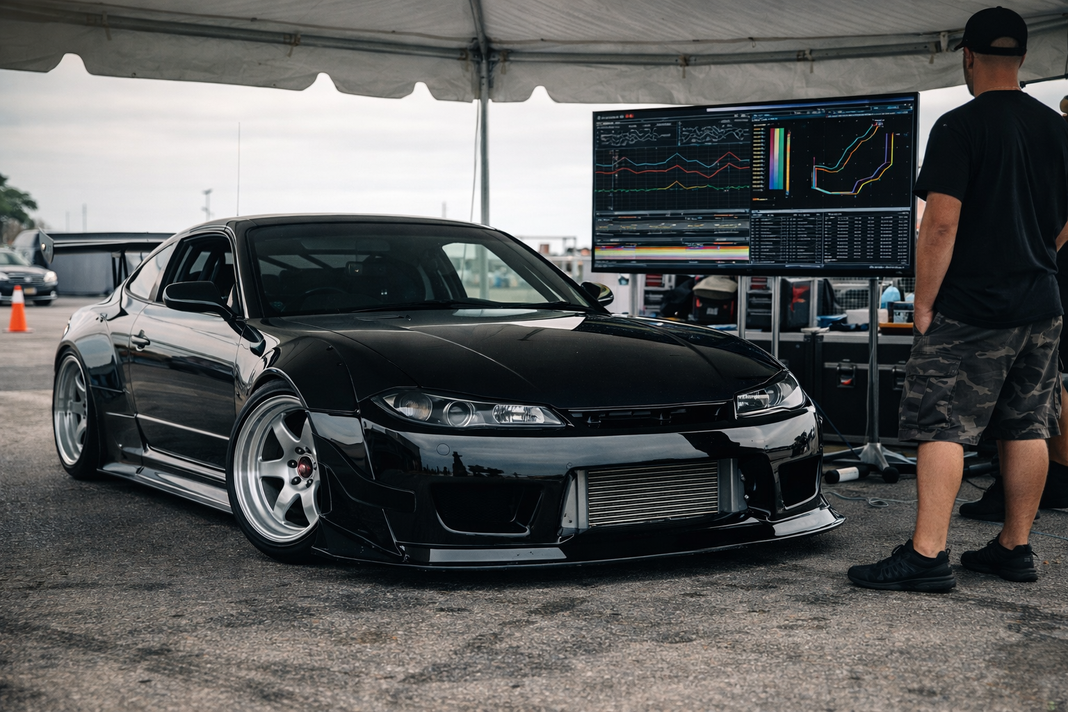 Drift telemetry and 3D drift car data analysis displayed beside a professional Nissan S15 drift setup